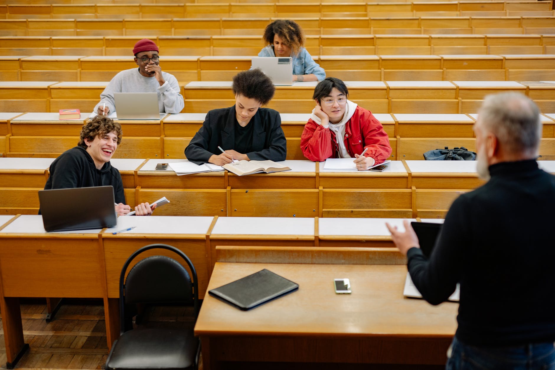 a professor interacting with his students